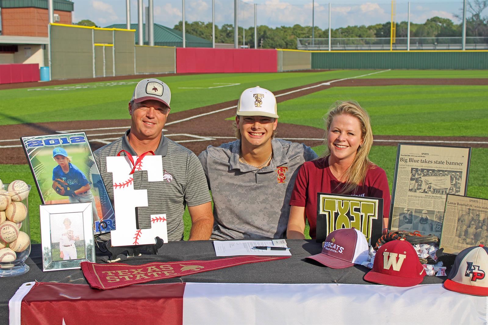 Cypress Woods High School senior Ethan Farris, center, signed a letter of intent to play baseball at Texas State University. 